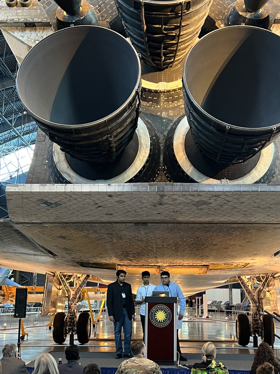 StemCSTeacher's tweet photo. Students from @LCPS_Academies giving their MVP presentation at the @airandspace museum hackathon under the space shuttle. Thanks to @DeloitteUS and @airandspace.  @csforlcps https://t.co/M6FBjdPBen