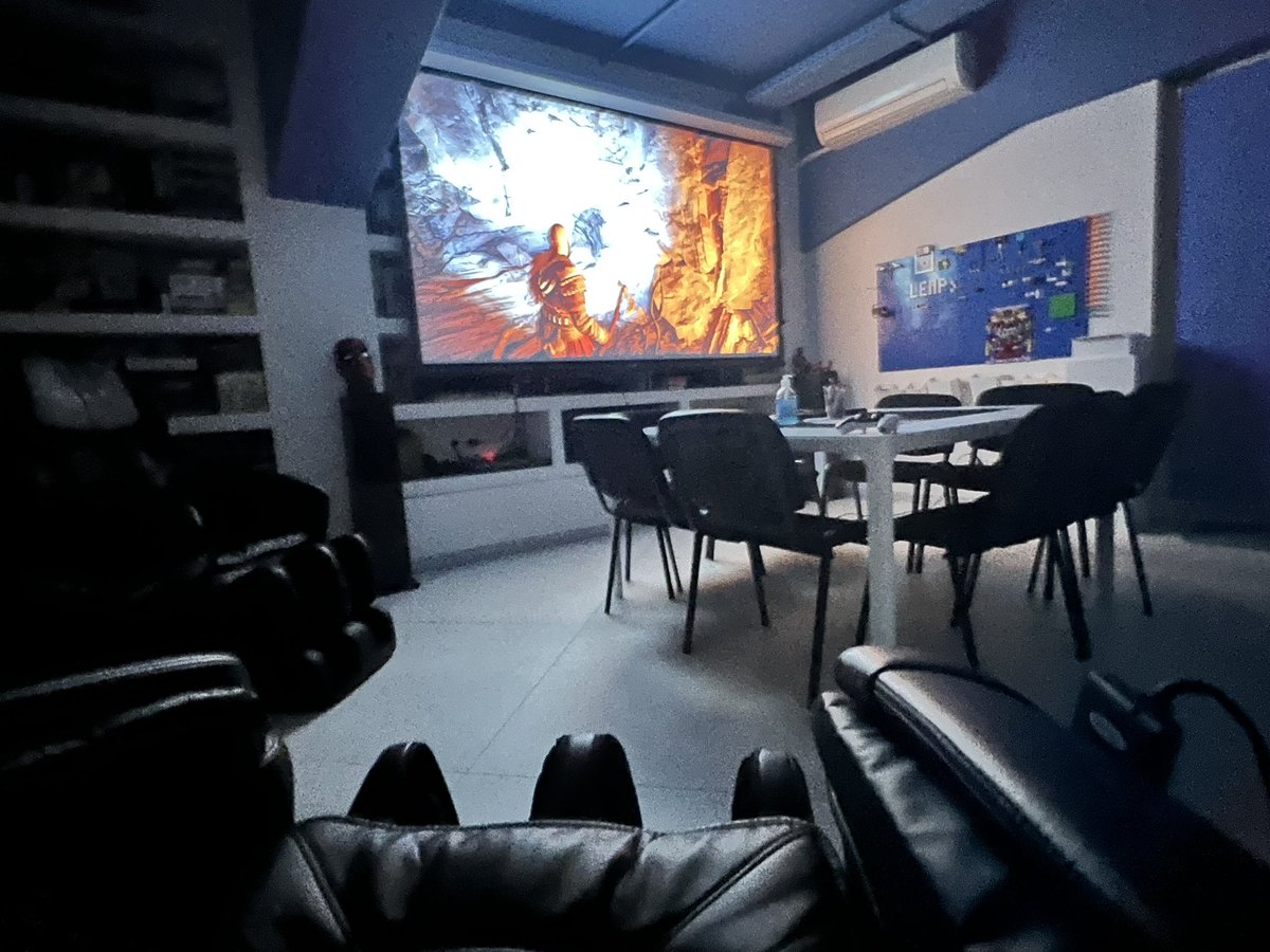 Enjoying God of War in 120’’ of the office, while having massage. #GodofWarRagnarok