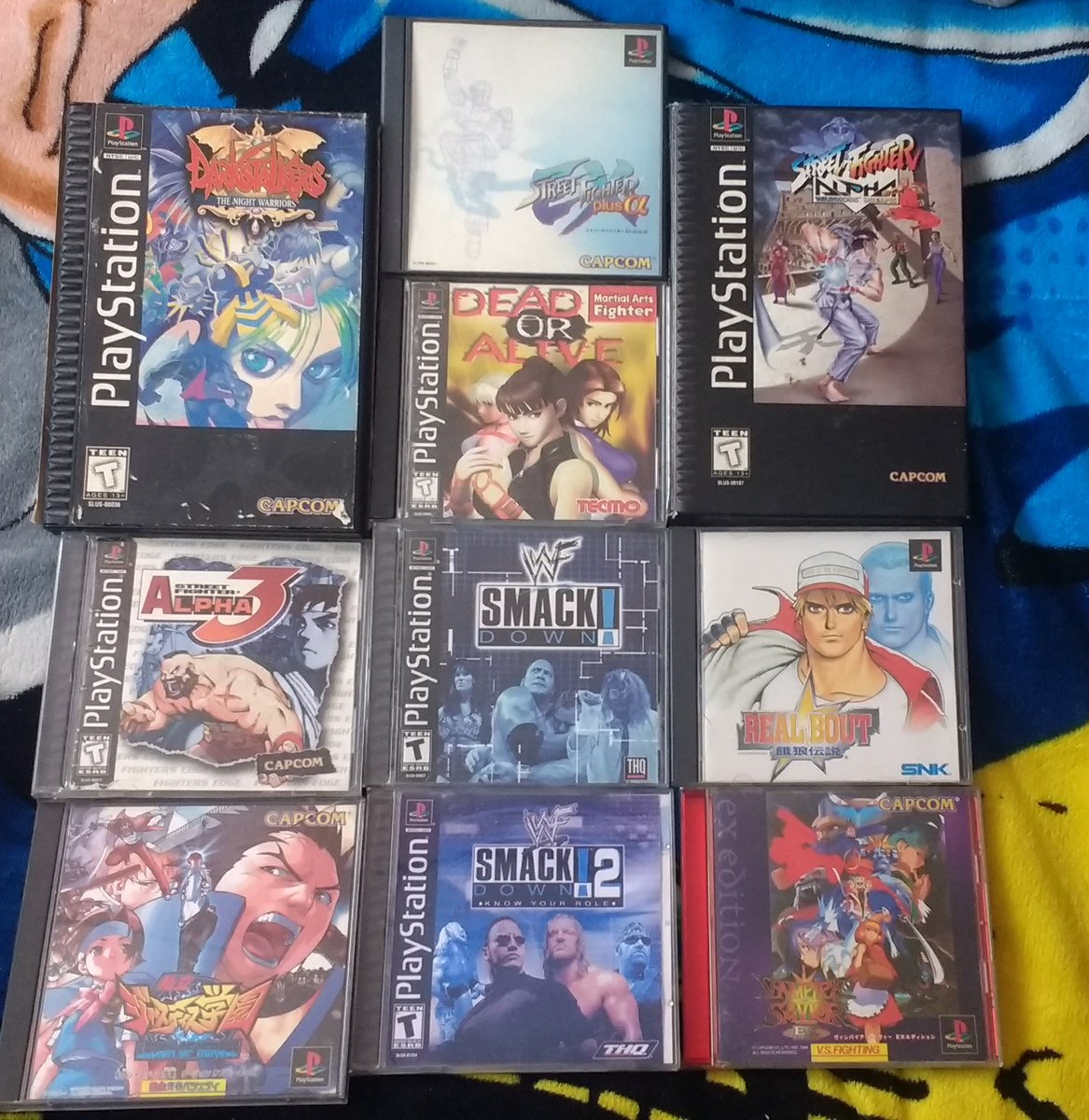 crossman311_077's tweet photo. My entire #PS1 Collection; from NTSC-U to NTSC-J &amp; PAL region games + 3 demo discs, &amp; my 10 favorites!  
#Playstation #PSOne #RETROGAMING #StreetFighterEXPlusAlpha #StreetFighterAlpha3 #DeadOrAlive #DarkStalkers #WWFSmackdown #RivalSchools #RealBoutGarouDensetsu  #PS1DemoDiscs https://t.co/owPpaQFycN
