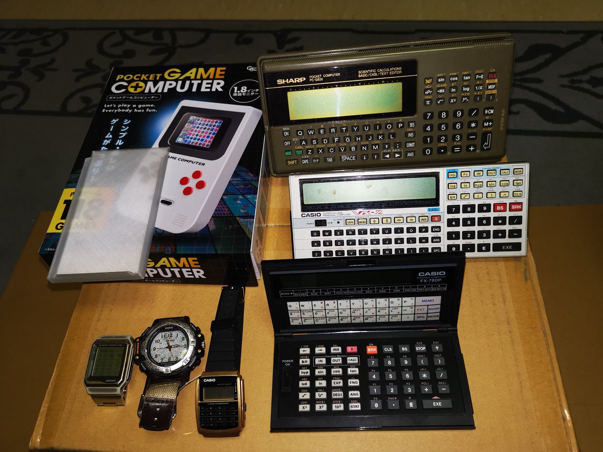 swartz_de's tweet photo. I love getting parcels from Japan! Today's delivery included some auction wins, a 3D printed pocket computer cover, a few watches to fill out the package & a cheap handheld games console! #casio #vx2 #fx780p #sharp #g820 #ポケコン https://t.co/TWL4HMmylx