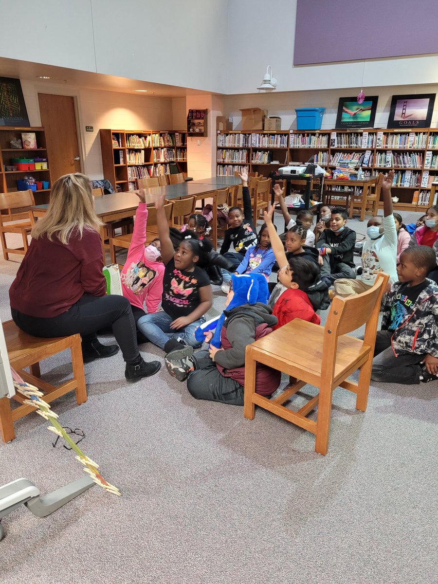 RealMrsAshley's tweet photo. Such a thrill to watch Mrs. Filas, a masterful teacher, enthrall Ms. Lee's #3rdGrade Ss at THE Marvelous Miles J. Jones ES #Library! Thank you, Mrs.Filas and @VACreditUnion for these amazing #economics lessons! #MJJMagic #Learnaboutmoney @LitLimo @RPS_Schools https://t.co/2UEUvGWaJ2