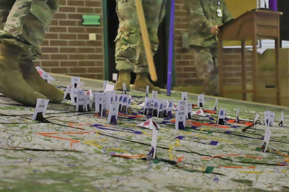 ArmyGeospatial's tweet photo. #BigMaps Don't forget to take your boots off when walking on this @VCorps combined arms planning map. https://t.co/ScR4HY8ilC