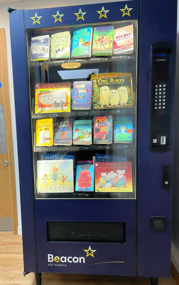 BeaconAceAcad's tweet photo. Our brand-new Beacon book vending machine!
Each week, our 'Shine Brightly' children will have their names put into golden hats, 3 lucky winners get a token to use in the machine! A brilliant incentive for all the children. 
Good luck everyone!  #readingforpleasure @KLacademytrust https://t.co/EbL17Q4xgt