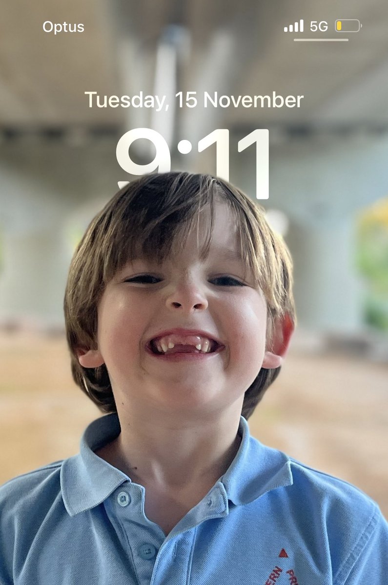 Sick iPhone trick. Take a photo in portrait mode and make it your wallpaper. The time disappears behind the subject.