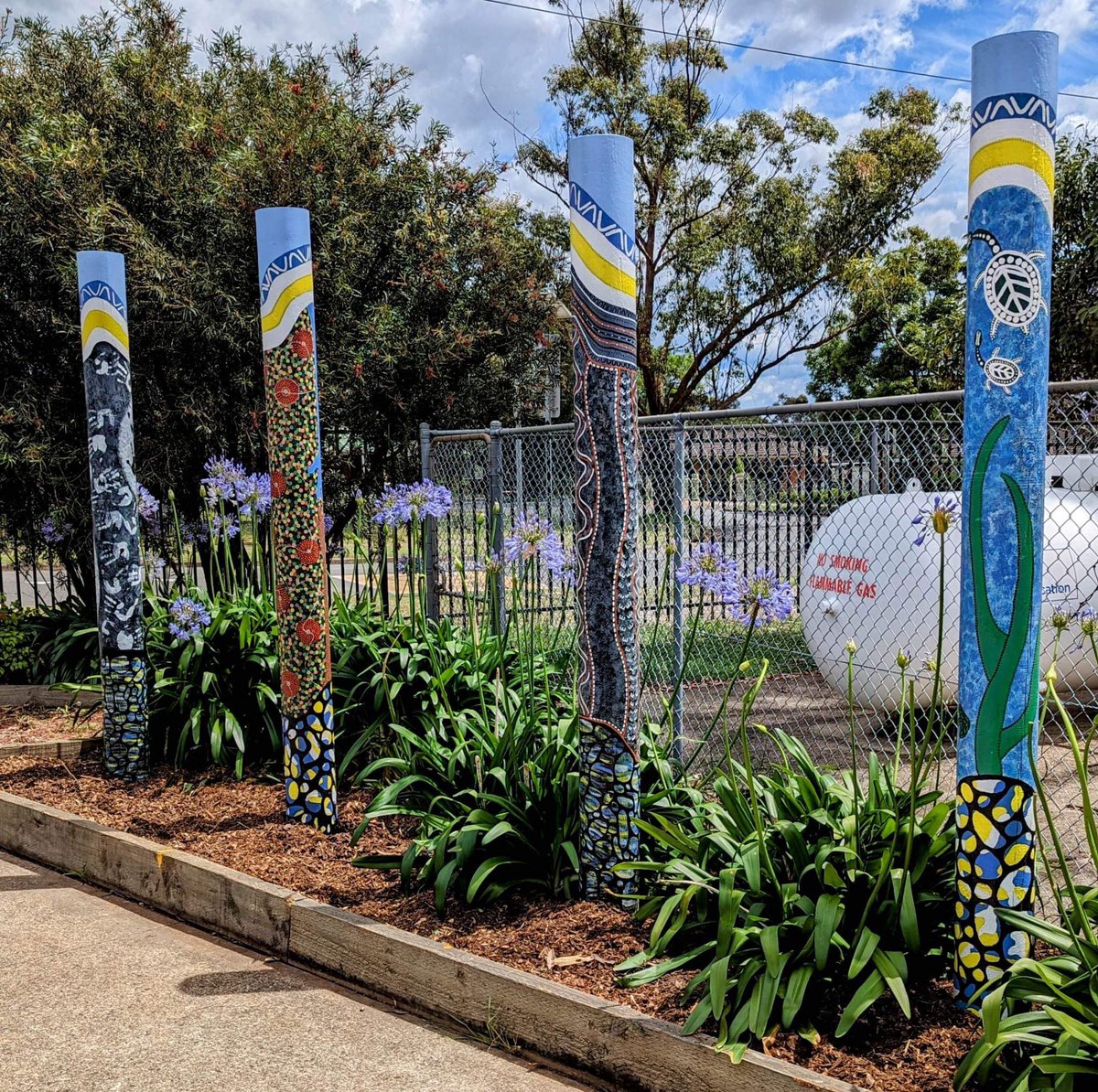 Our new Aboriginal poles taking pride of place at the entrance of QHPS. Thank you to Jody Hoskins for all her hard work. #lovewhereyoulearn