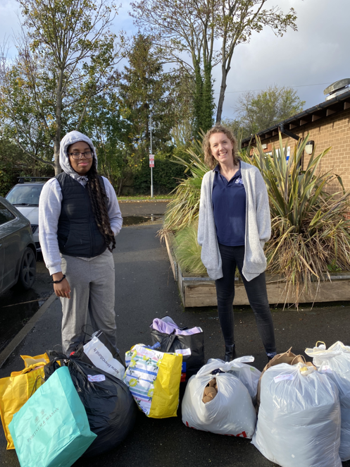Ramiya handing over donations to Rosa at Together As One following their appeal for winter clothes for local refugees.  #WeAreHaybrookCollege #OneSlough