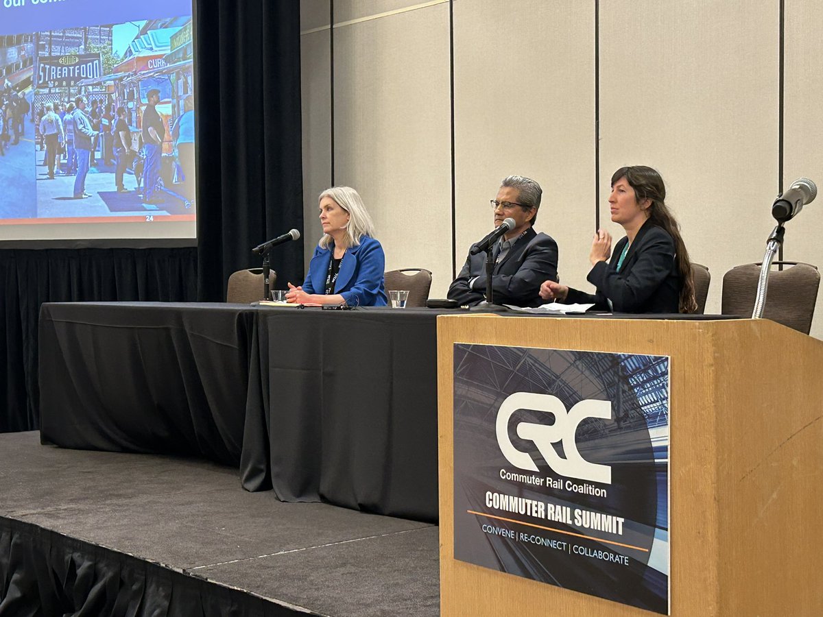 Caltrain's tweet photo. Caltrain’s Communication Director Casey Fromson (right), Chief of Caltrain Electrification Pranaya Shrestha and Nadine Fogarty, Caltrain’s Director of Transit Oriented Development (left) discuss Caltrain: Building for the Future with attendees. #CRCSummit22 https://t.co/8eXklCfYyR