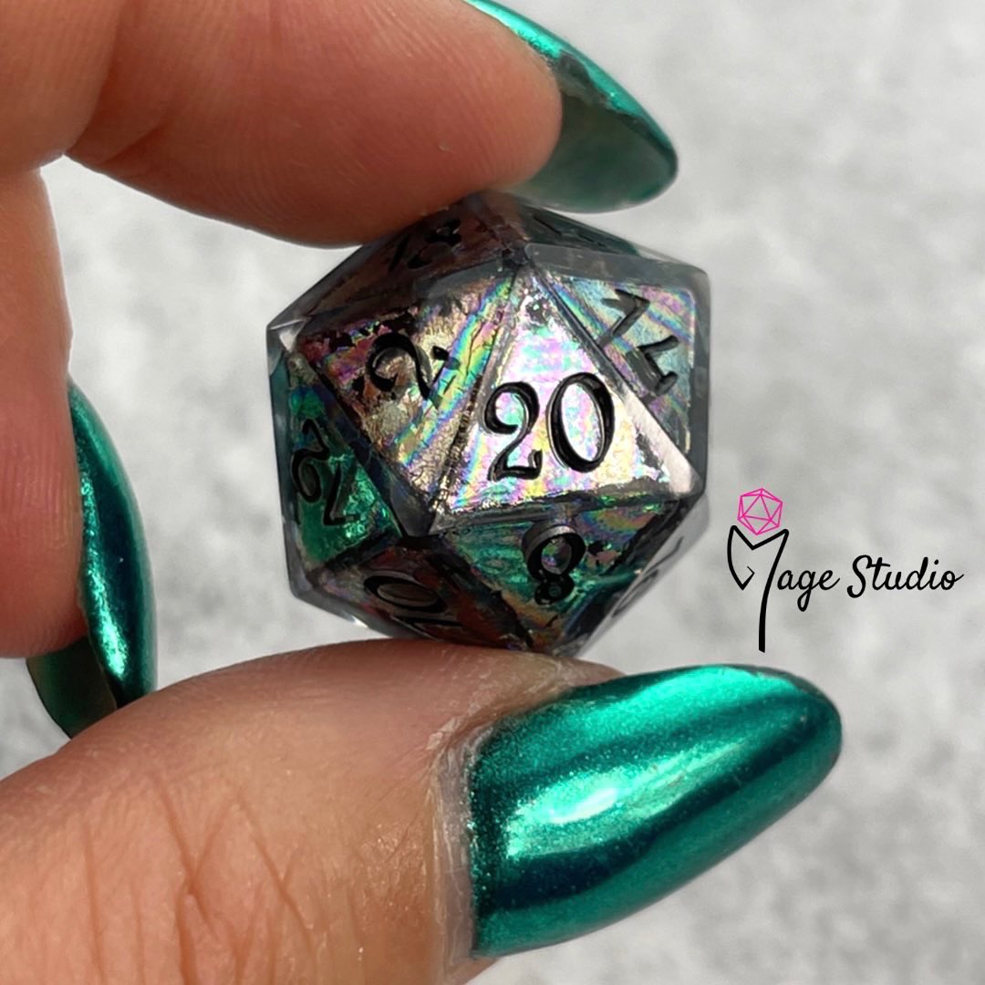MageStudio's tweet photo. The Oil Slick D20 is a very similar design to the Bismuth but it has a slightly different pattern. What do you think?
Check out my shop https://t.co/g3XpNROj7O
#dice #d20 #resindice #magestudio #magestudiodice #handmadedice #dicemaker #dnd #dungeonsanddragons #rpg #erpegi #dnd5e https://t.co/76bRFPWbzN