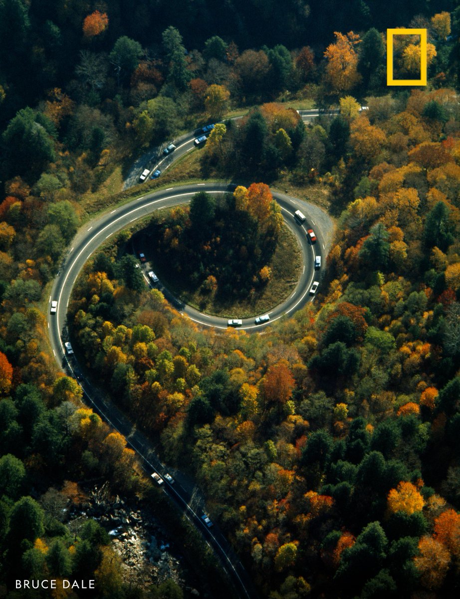 Cars drive along Route 441 as it spirals and crosses itself on a bridge in Great Smoky Mountains National Park, USA.