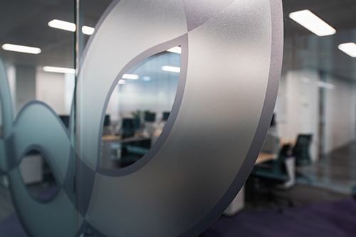 WFAANZ member Paragon demonstrates the branding power of decorative film with this Print Media Group (PMG) project. Part of a fit out of the Sydney Ribbon Communications office, the job included custom multi-layered reception signage, print and profile cut glass graphics.