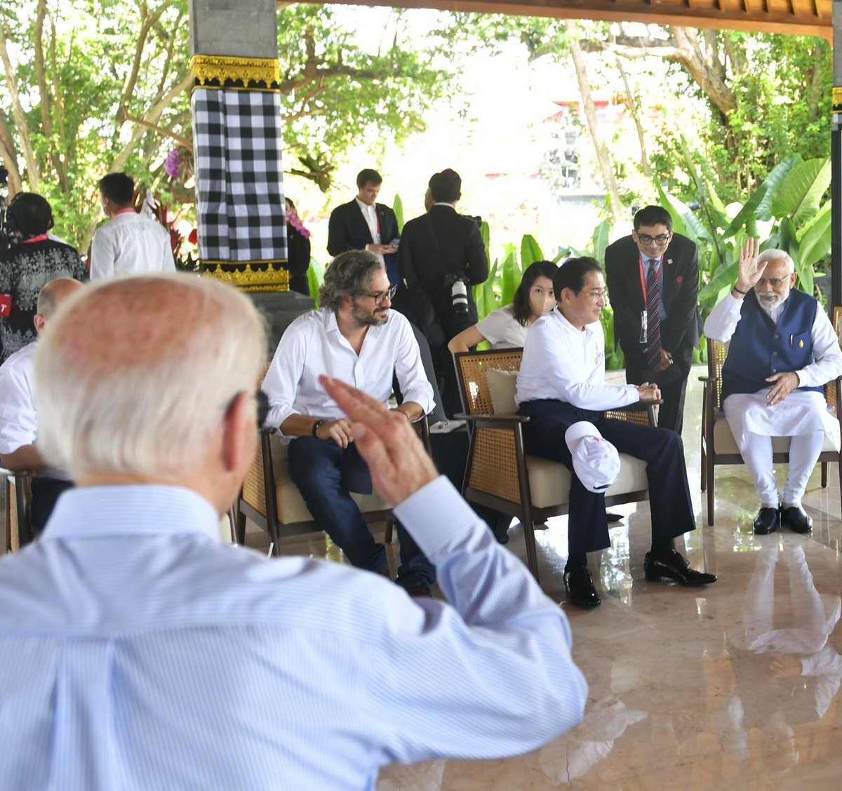 ANI's tweet image. PM Modi and US President Biden exchange greetings at the Mangrove forest visit in Bali, Indonesia during the #G20Summit2022
