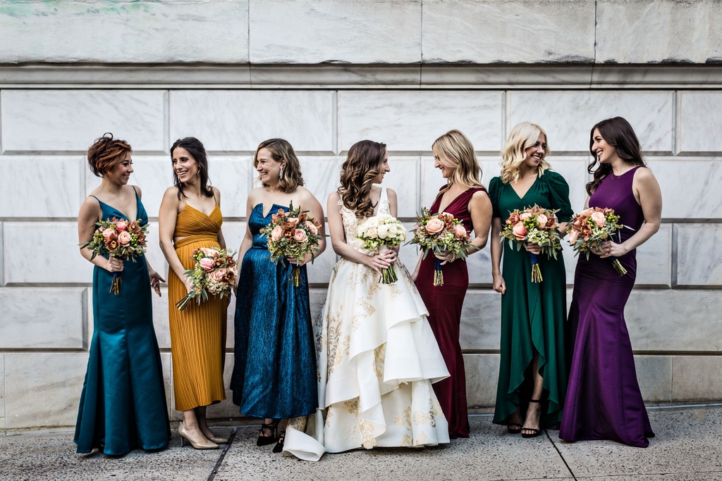 Having bridesmaid dresses in different colors is an awesome idea!