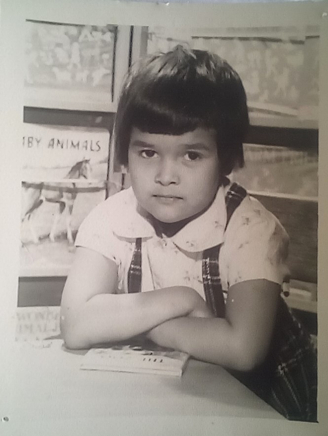School libraries are a vital part of a child's education; this is me, in my school library where my enduring love of books began. <a href="/Literacy_Trust/">National Literacy Trust</a> <a href="/bwb/">Ben Fox 📚🗽🌎🇺🇦</a> <a href="/worldkidlit/">World Kid Lit: global literature for young people</a> 
The dodgy haircut was my own handiwork! Lucia😃