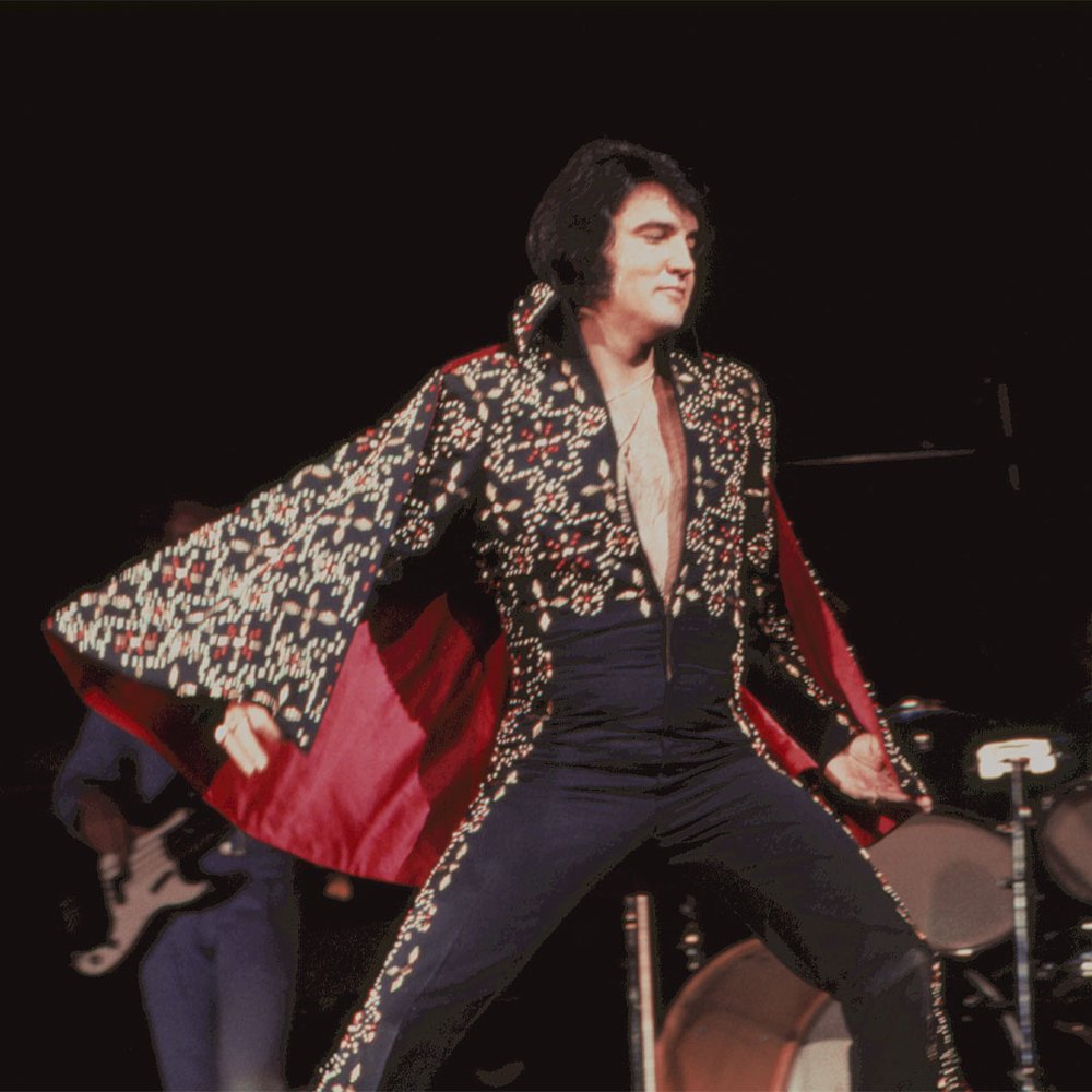 This black jumpsuit with a matching red lined cape is called the \, image size:1000x1000