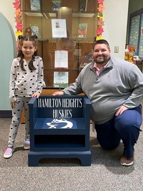 CASDNews's tweet photo. A Hamilton Heights Elementary School student recently donated a Huskies reading bench to the school library, which the student assisted in building. The bench will be able to be enjoyed by all students as they read. Great job!

#trojanspotlights https://t.co/bcjMDAiwal