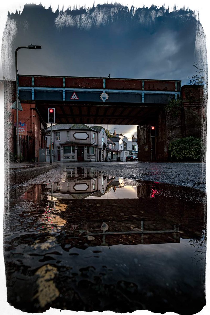 george_fisk's tweet photo. The bridge #whitstable #greatbritishcoast #town #kent #reflection #creativity #rain #puddle #portraitview @thewhitwhistler @WhitstableLive @VisitCanterbury https://t.co/gVhsgJBiPe