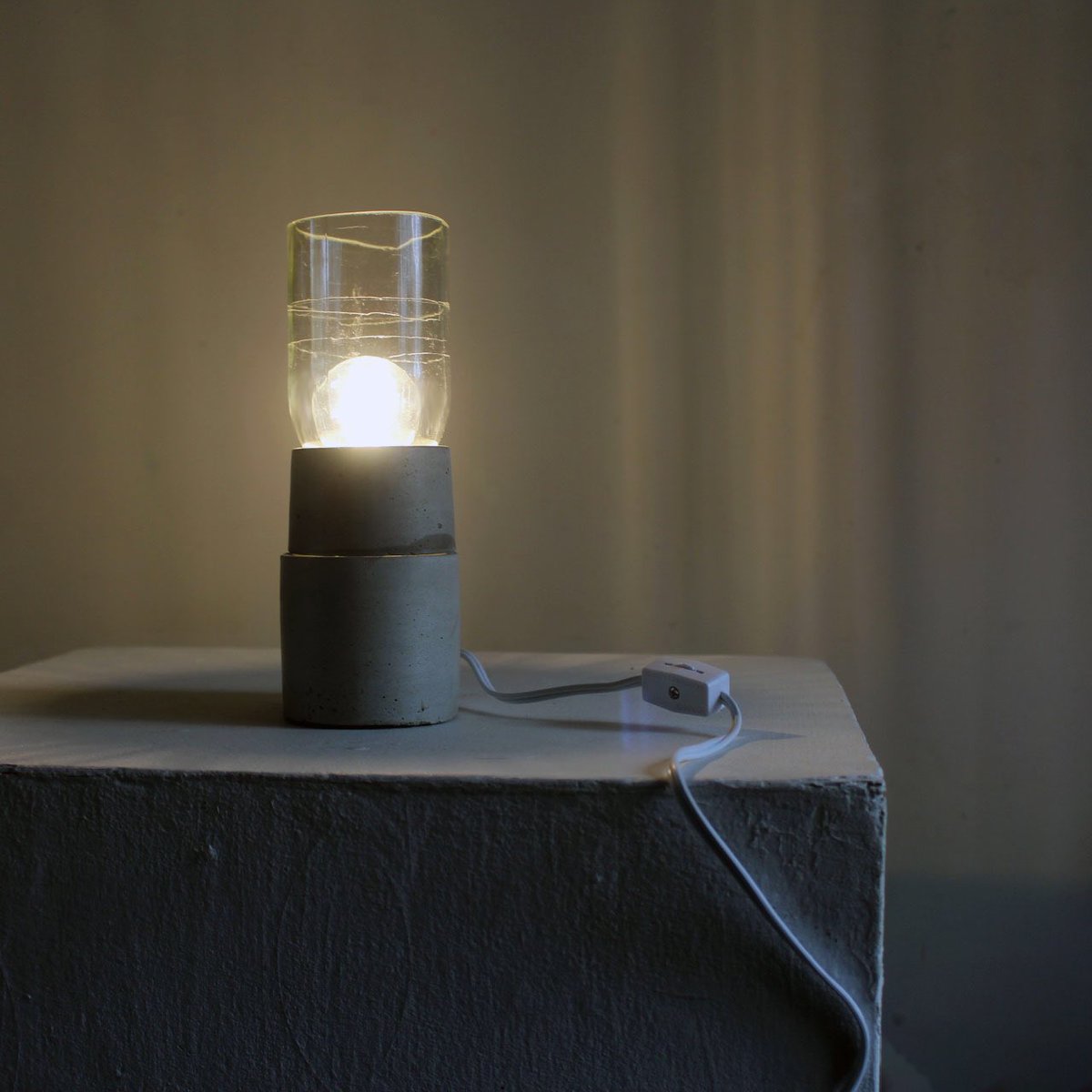 Here is the next lamp. I discovered that bottles sometimes are really scratched up. #lightingdesign #lighting #productdesign #concrete #Sculptures #reclaimed #makers #glass