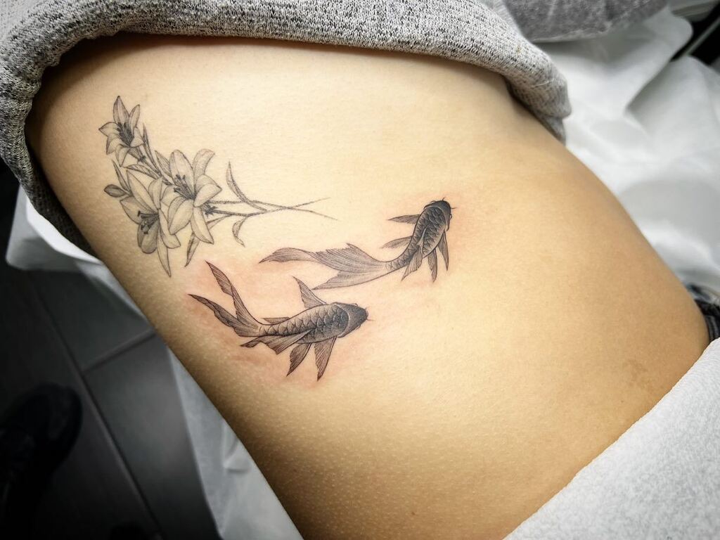 Jingstattoo's tweet photo. Thank you Nana for coming back to me! Btw orb lilies and koi fish were done by me! Lily as healed 6 month tattoo and koi fish is fresh! 
#koifishtattoo #lilytattoo #healedtattoo #freshtattoo #healedvsfresh #ribcagetattoo #fineline #smalltattoo #koifish #… https://t.co/nwC748xG32 https://t.co/EvGaHcGJSz