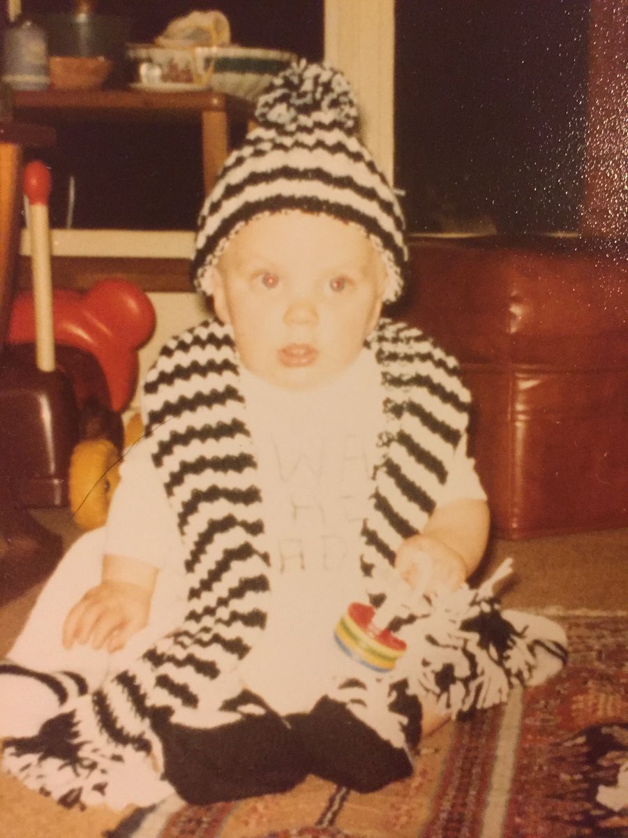 Myhiddenmonkey's tweet image. Just got sent this photo by my mum 😂 Me circa 1981. Hat and scarf knitted by my late Grandma. You can just make out #HWTL written on the T-shirt. If only I’d known 41 years ago I’d be watching us rip it up like we are now 🖤🤍 #NUFC