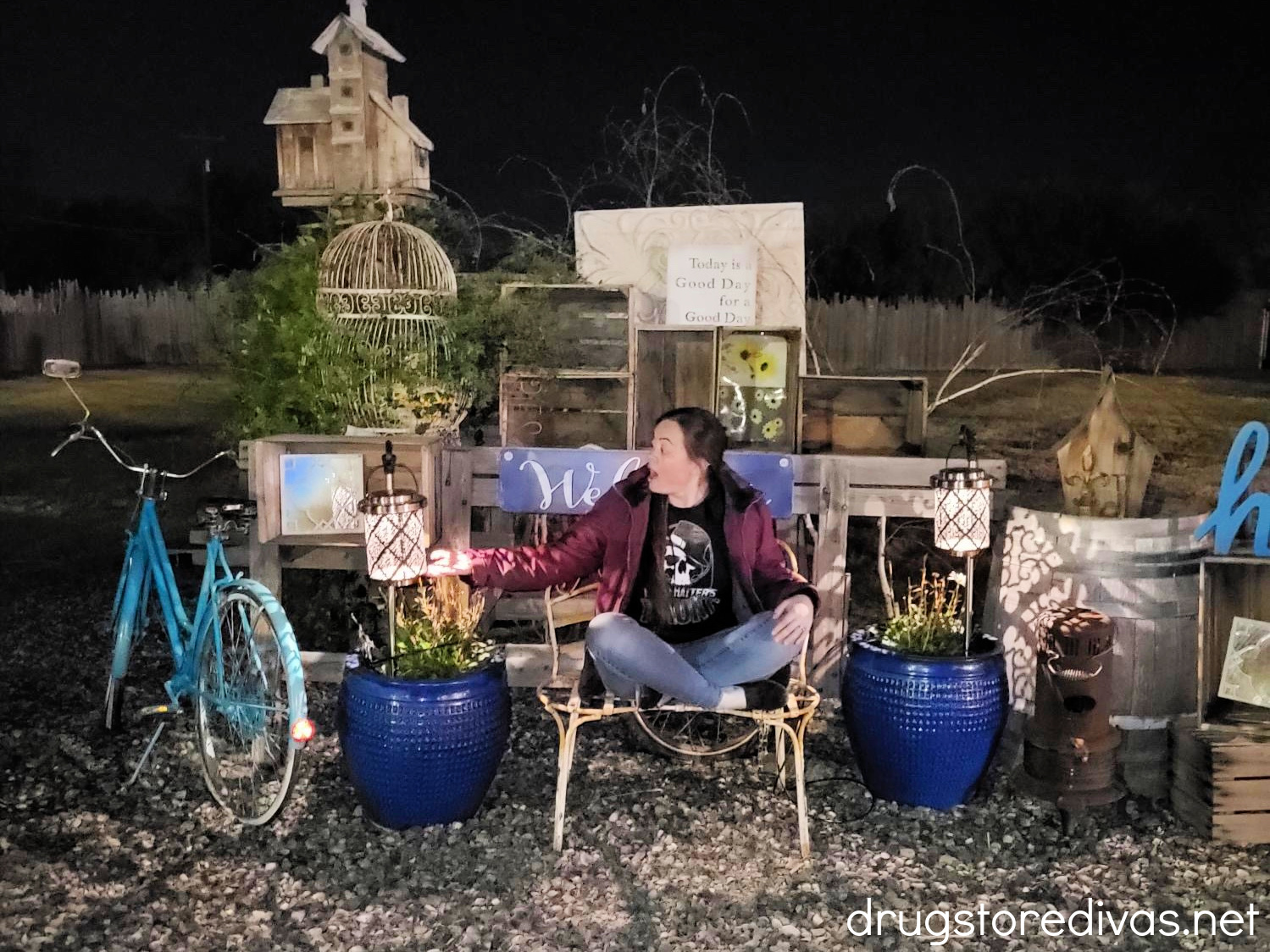 A woman on a set at a haunted house.