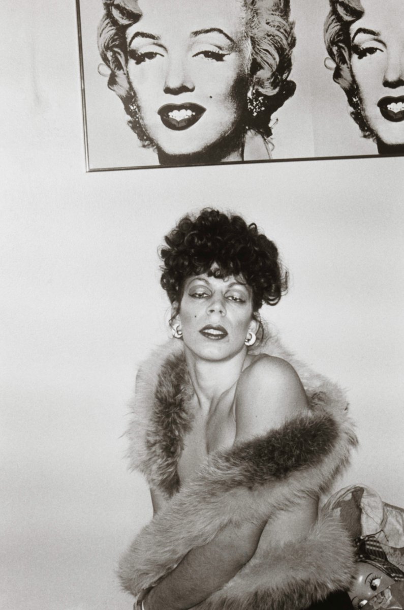 “Ivy with Marilyn, Boston” by Nan Goldin was shot between 1972 and 1974. This work contains a collection of black and white photographs of her friends at The Other Side, a drag bar in Boston. 

Learn more: gu.gg/3hAed8g
