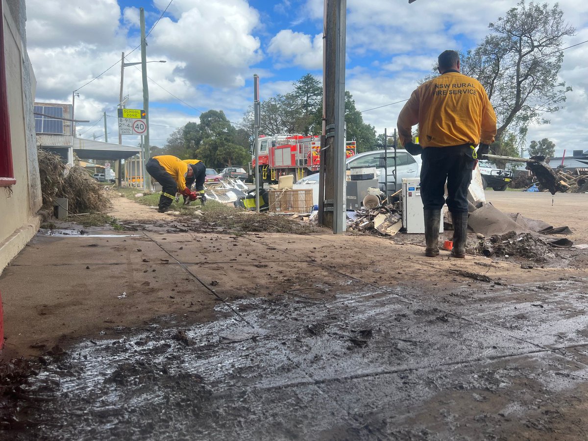 NSWRFS's tweet photo. Tracey and Judd opened their business in Eugowra just two months before flood waters inundated their store. During the flooding Judd stayed and helped rescue people off their roofs. Our #NSWRFS crews are so glad to be able to help with the clean up of such a wonderful community. https://t.co/sFtFAdzrGX