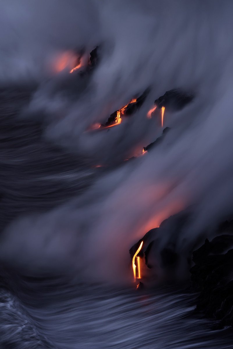 ryandyar's tweet image. Several fingers of lava creeping into the ocean on the southwest coast of Hawaii’s Big Island. A 1/2 second exposure gave this little scene the appearance of the water streaking in the same direction that the gaseous steam is being blown into the air.