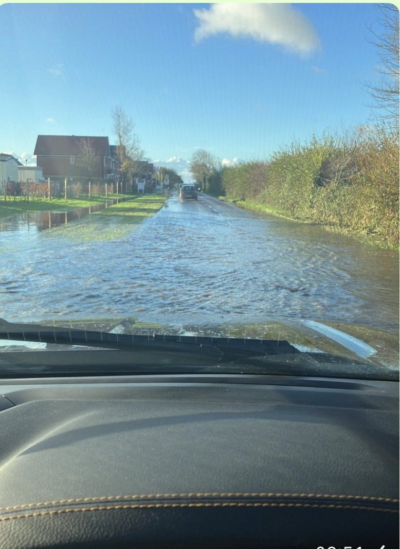 SOSCAlliance's tweet photo. The Manhood Peninsula is underwater TODAY. Sea levels still rising, rain will get worse &amp; developers still concreting our Grade II fields. The main road to Bracklesham is a river with 100s of new homes on one side and 100s more planned for the other. @ChichesterDC @GillianKeegan https://t.co/K7xaGRkyPp