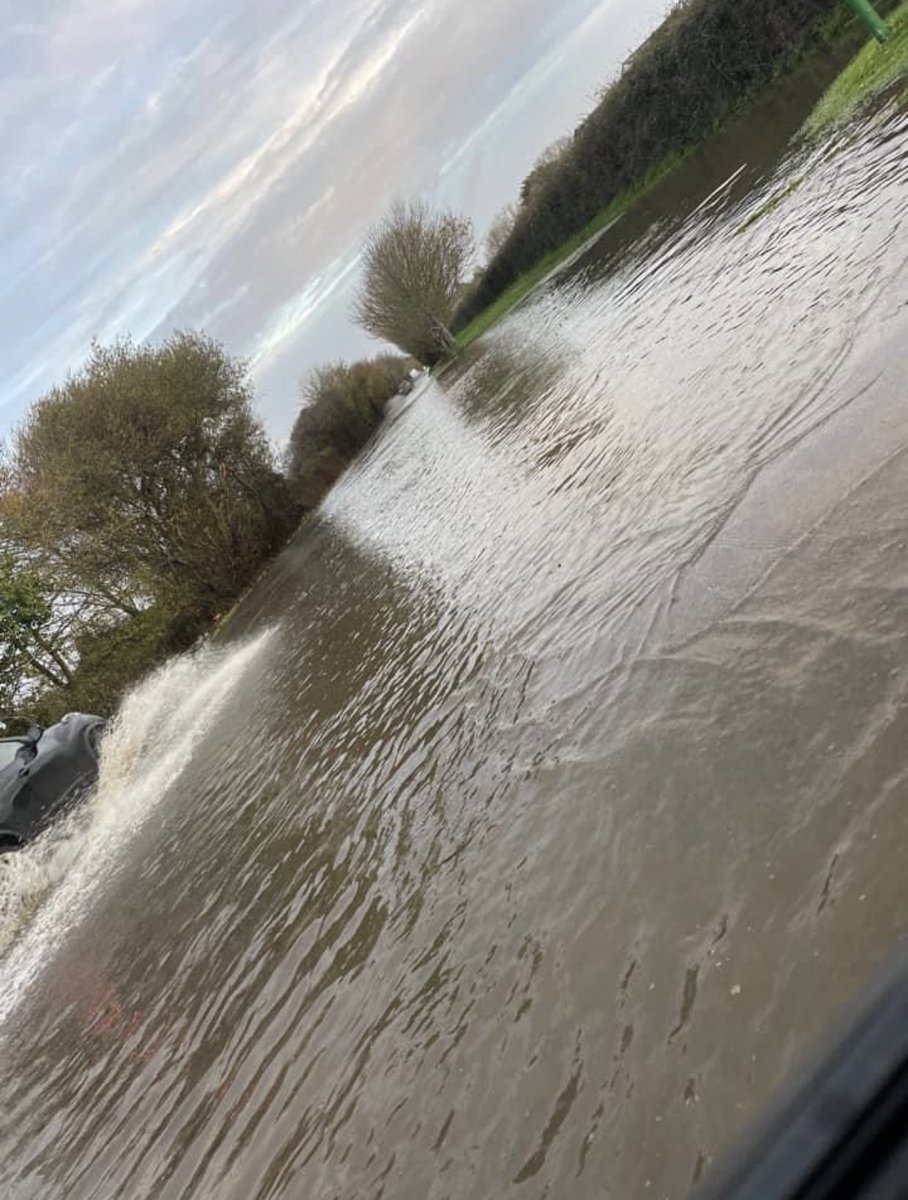 SOSCAlliance's tweet photo. The Manhood Peninsula is underwater TODAY. Sea levels still rising, rain will get worse &amp; developers still concreting our Grade II fields. The main road to Bracklesham is a river with 100s of new homes on one side and 100s more planned for the other. @ChichesterDC @GillianKeegan https://t.co/K7xaGRkyPp