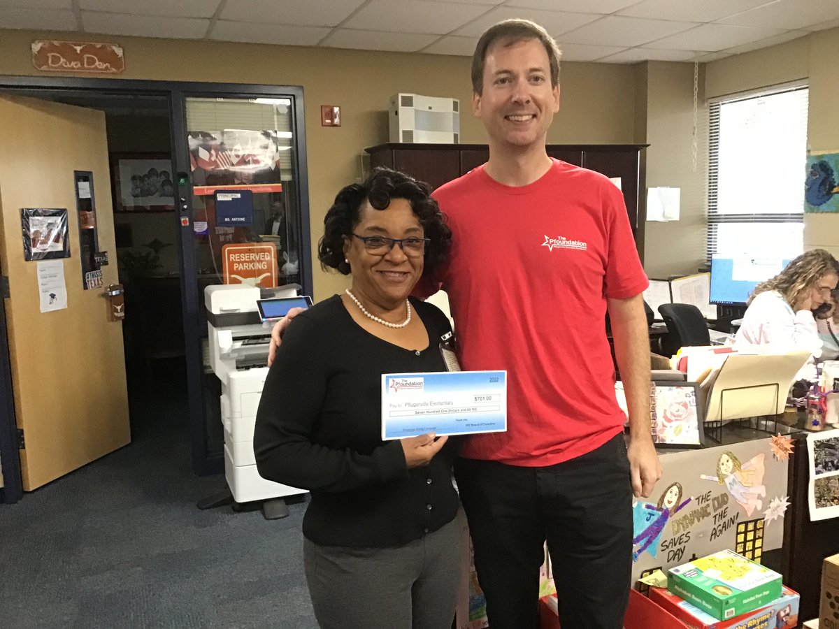 Principal Genia Antoine with Garret Martin PEF member receiving cash-back check for Employee Giving Campaign. PES is Goldstar campus! Thanks to the Pflugerville Education Foundation!