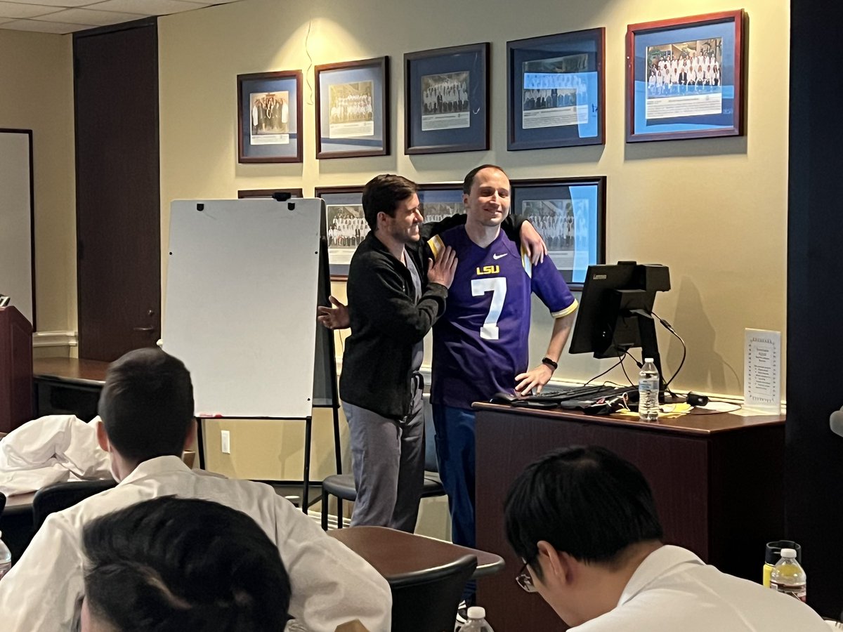 After losing a football bet, Nick Roy (PGY2) is pictured leading oncology board review during noon conference repping some new collegiate gear 😬