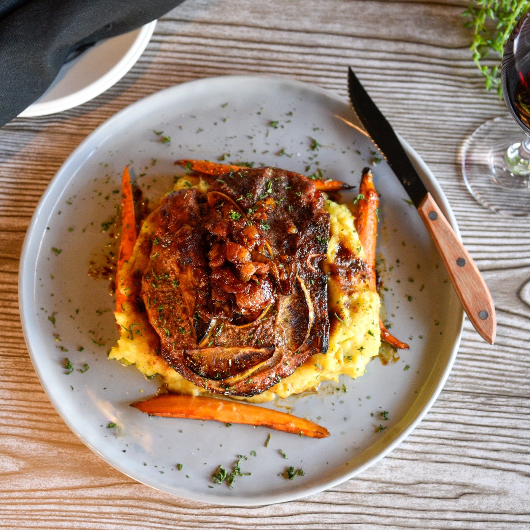 Our 16oz Porterhouse Pork Chop is marinated in apple and rosemary, sous vide and served with bacon jam, glazed carrots, and yukon mashed potatoes. 

See why ESG is East Fayetteville's favorite local bar and grill! 

#ESGfayetteville #FayettevilleAR #NWAeats #PorterhousePorkChop