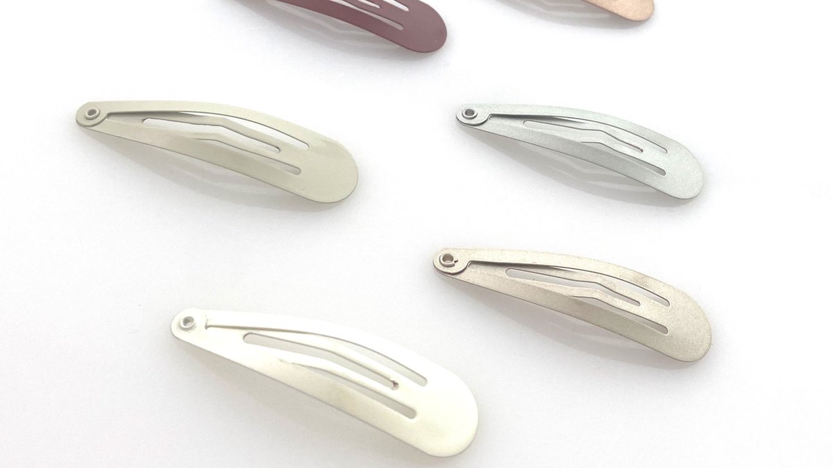 New sleek and sturdy Heliums snap clips. They blend with your hair color and are perfect for kids and adults. Strong, light and easy to snap on to keep hair in place.