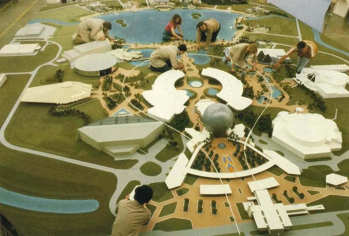 HistoryAtDisney's tweet photo. Imagineers work on putting the finishing touches on the model for EPCOT Center. https://t.co/hiJh2wgu6M