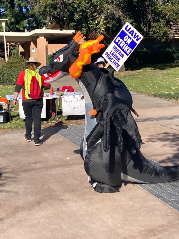 MEWBOSS's tweet photo. Even bootleg Mega Charizard X supports #UCstrike #UAWonStrike #FairUCNow https://t.co/YiaDbQmXrB