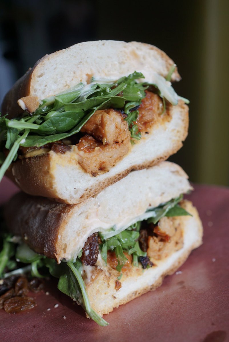 New vegan greatness : The Harissa Tomei - Lemongrass “Chickn”, Sliced Cucumber, Harissa Mayo, Raisins, Chipotle Hummus, Greens. It’s good good. 
#yegfood #yegvegan