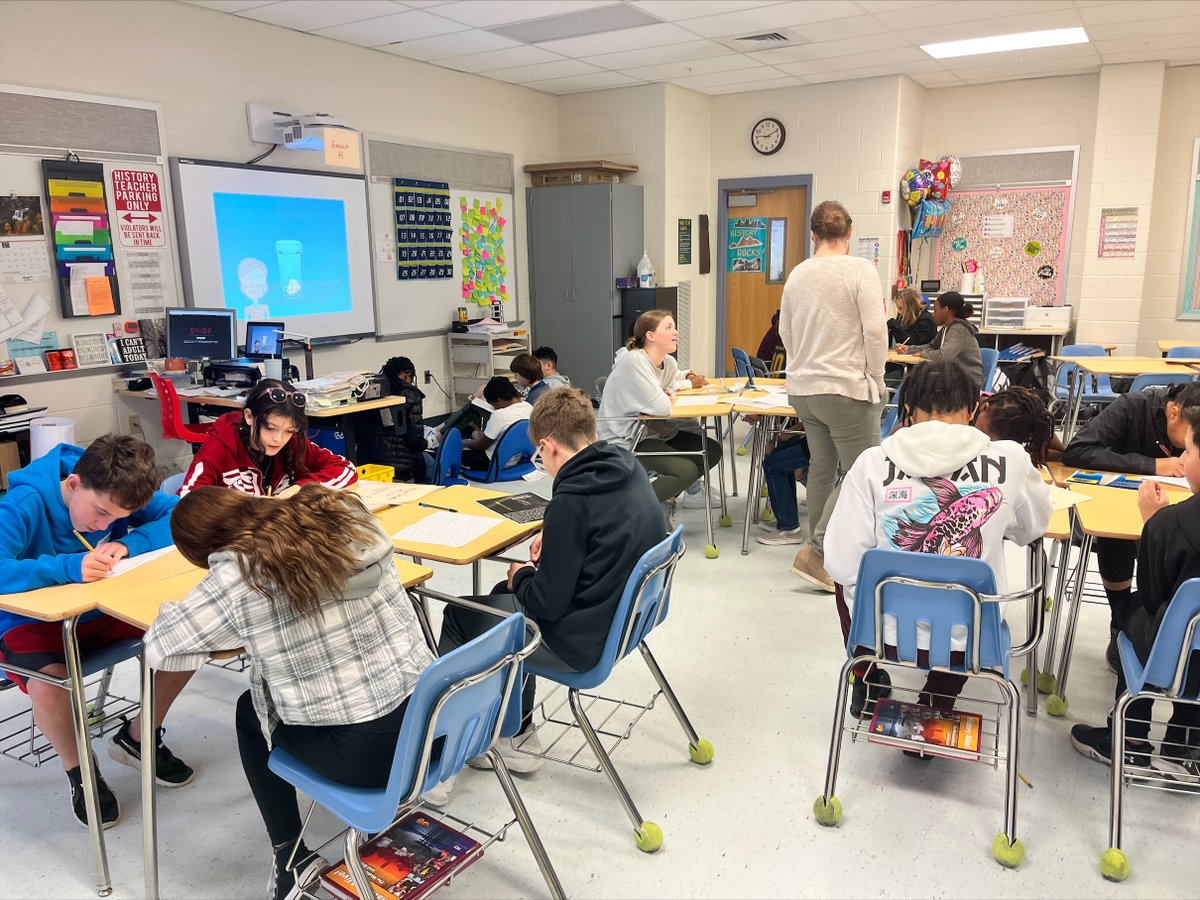 Dr. Western's students working hard in 7th grade social studies to determine the relative values of gold vs halite (salt) in their study of West Africa.