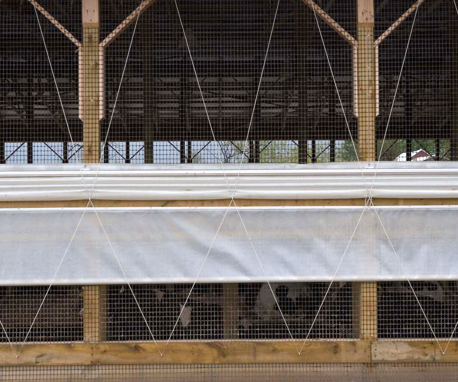 #TopDownCurtains permanently fasten at the bottom of the opening and are lowered from the top. Cold air enters high on sidewalls ensures ventilation w/min draft, reduces interior condensation/freezing. #singlecurtainsystem for dairy/beef housing. 9oz Fabrene fabric