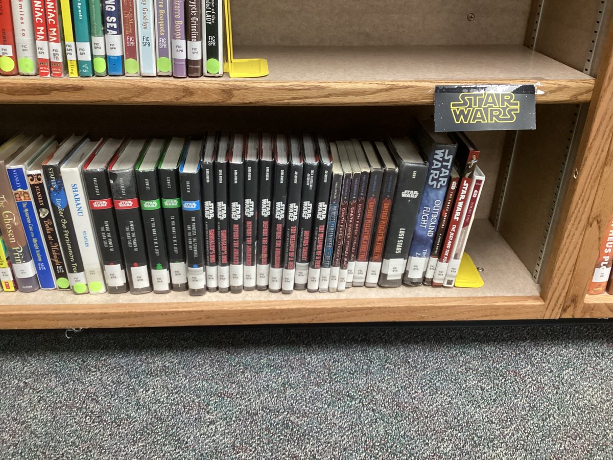 Shulok2022's tweet photo. On Friday before Thanksgiving break, I had the honor of volunteering in the @DelDiosAcademy library, helping librarian G Trupp. We relabeled all the Star Wars books to be grouped together instead of by author. And I learned a lot about the role of a MS librarian! https://t.co/WqKsQ1E2jN