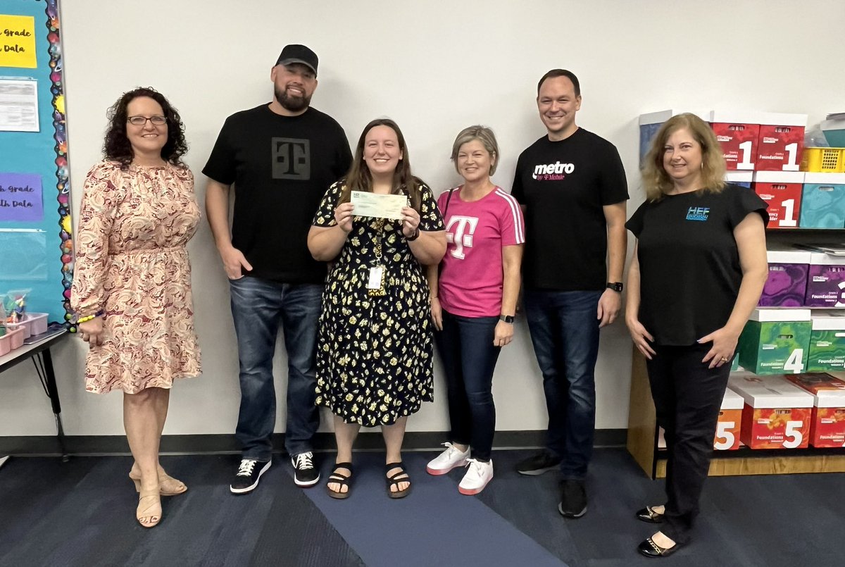 golfmom_suzanna's tweet photo. Next stop was to give Lindy, a first year teacher, a check to build a library of culture and diversity for her class at @HCPSMcDonald . I love how @TMobile allows us to support our communities through the #VolunT grants! https://t.co/pTNUrWPAzS