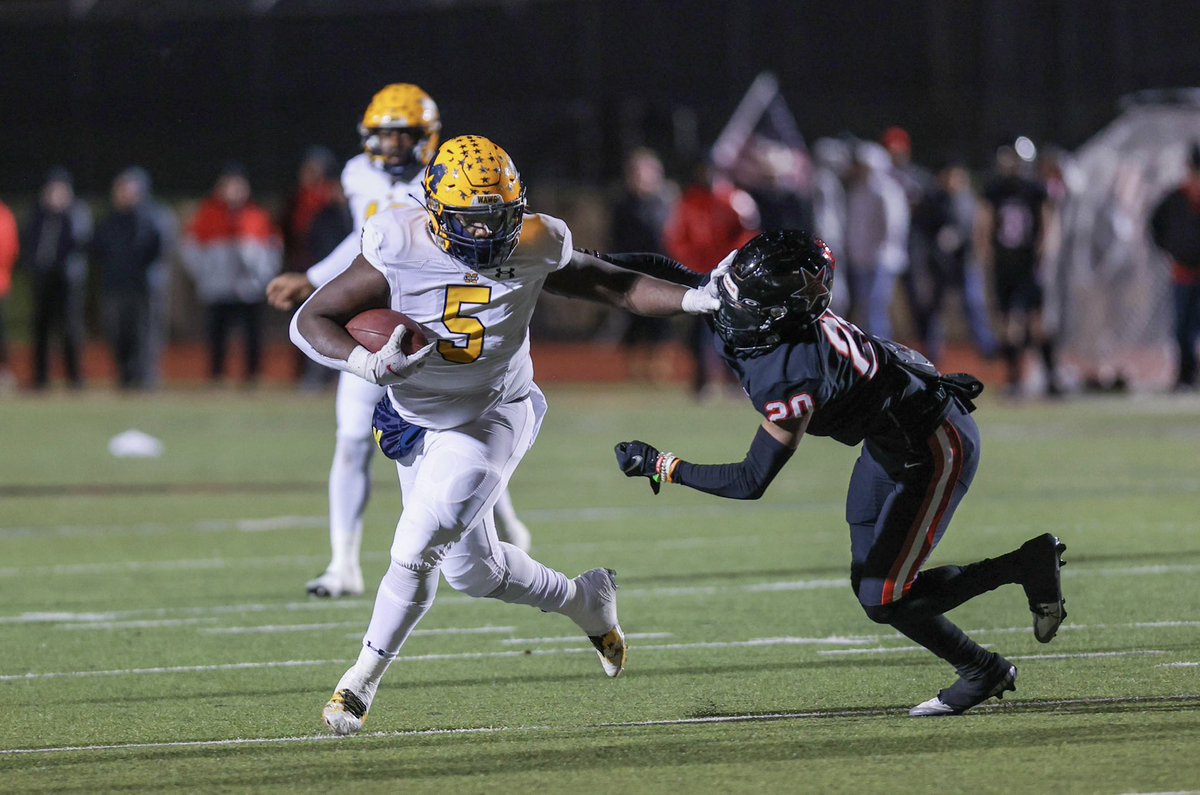 manestreamnews's tweet image. Photo of the Week: Running a route, junior D’Kedrion Abrams stiff arms an opposing defender . Photo by Sydney Allan.