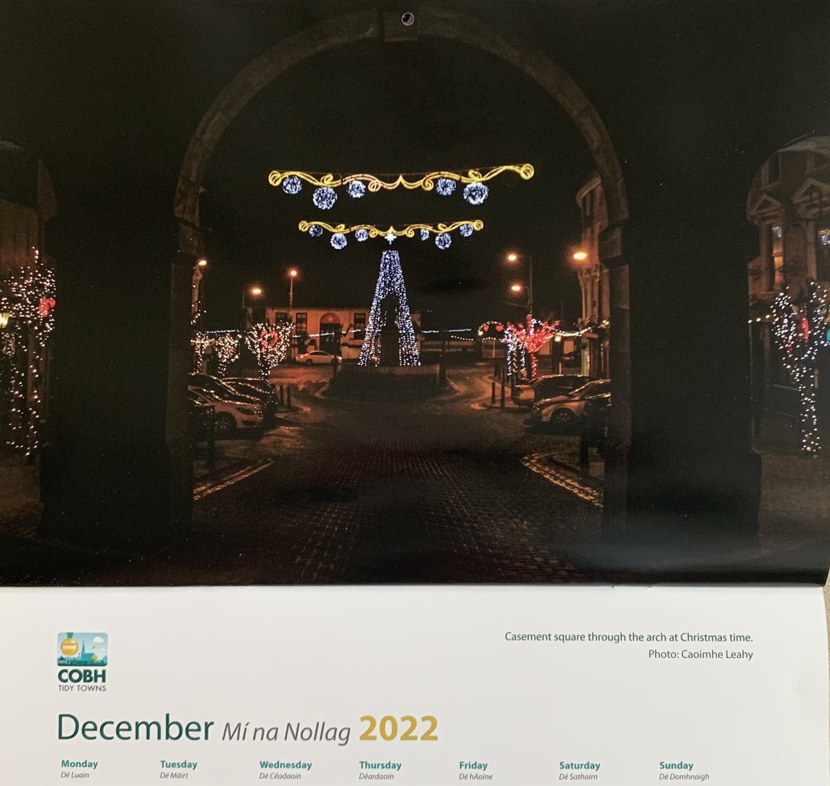 Last photo in our 2022 calendar for December. The Christmas lights captured through the arch. This years lights will be switched on Friday evening at 5pm. 🎄❤️ <a href="/CobhHarCham/">Cobh&Harbour Chamber</a> <a href="/Corkcoco/">Cork County Council</a> #cobh #lights #cork #calendar