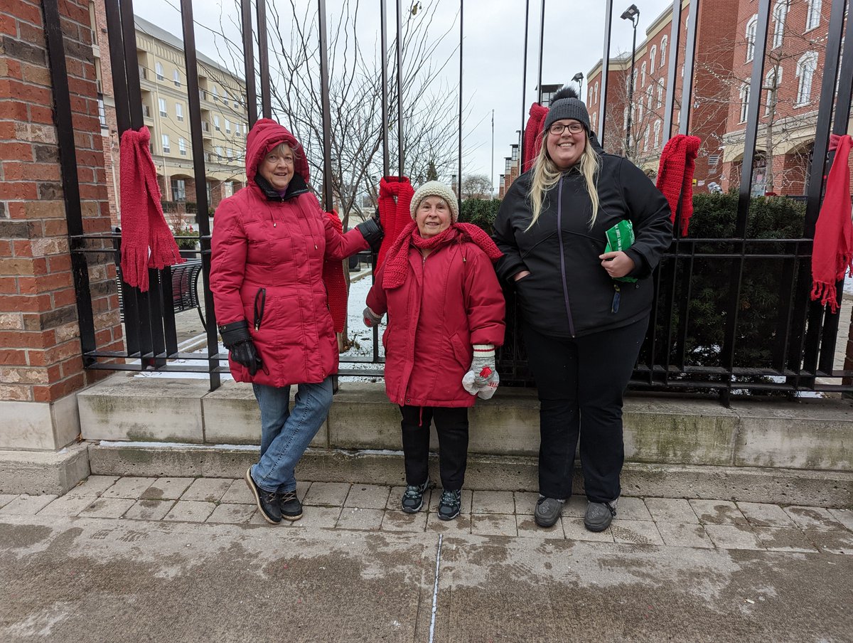 positivehn's tweet photo. Jamie and some members of the Grand River Grannies have been busy hanging red scarves at Harmony Square in downtown Brantford today.
#AAW #redscarfcampaign #theaidsnetwork https://t.co/g8FtpWfzlY
