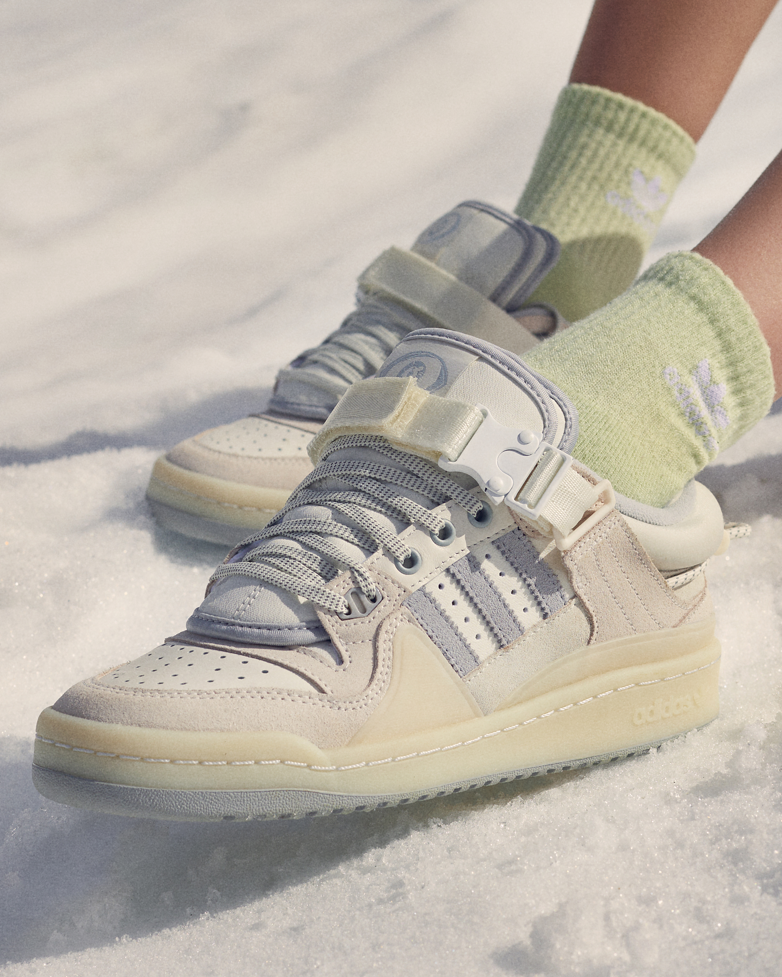 Foot Locker X: "Summer in you siempre ☀ Bad Bunny's latest Forum features an all-white paying homage to an endless Summer in the Winter months. Available on December