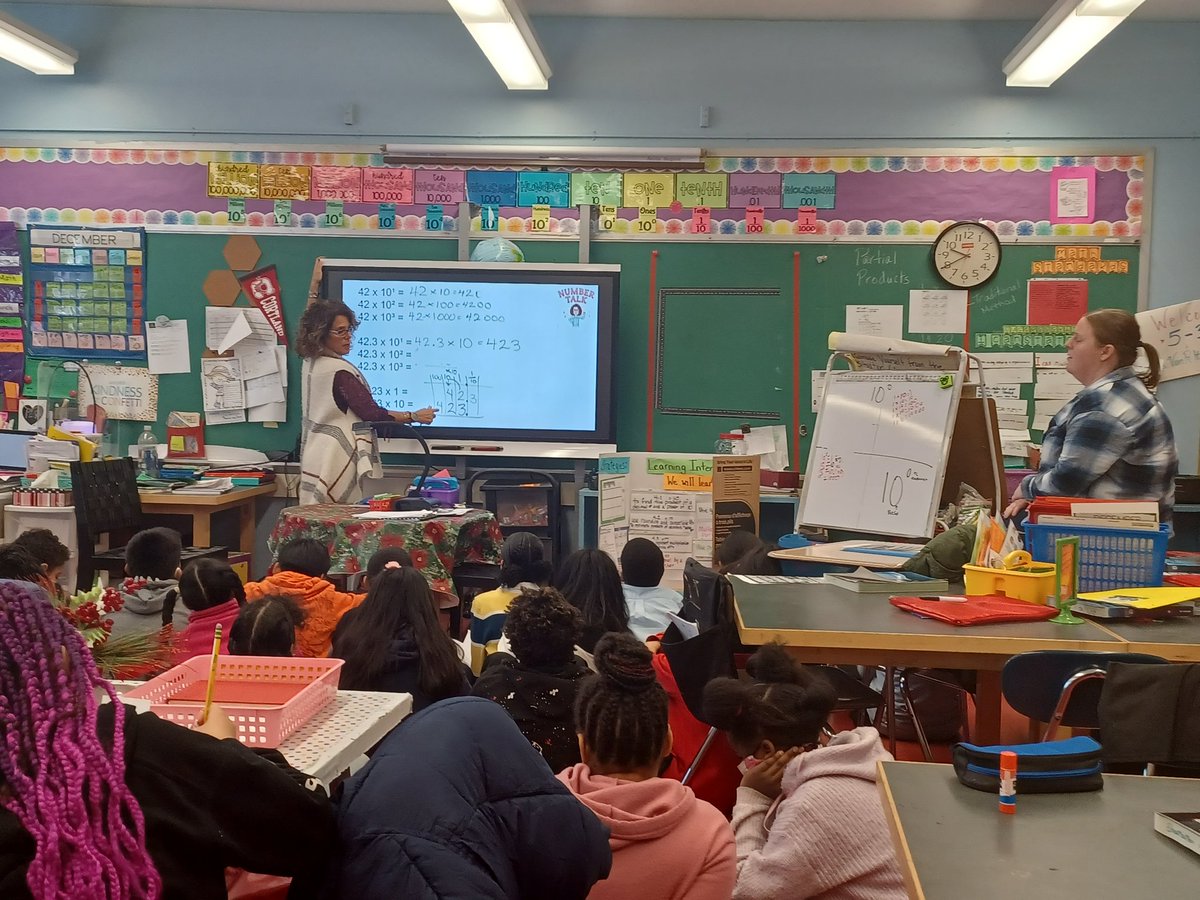 Mrs. A. Ezzo and Mrs. Van Pelt are facilitating a Number Talk that will transition to multiplying Decimals by Powers of 10. Providing feedback is essential to maintaining effective pedagogy!