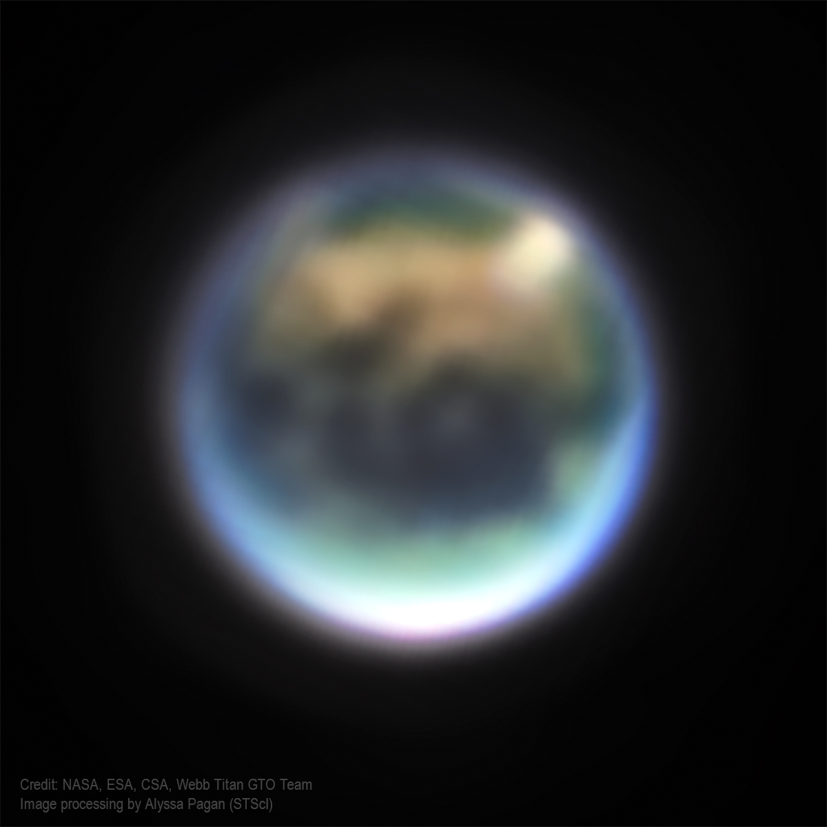 A view of Saturn's largest moon Titan made from infrared observations acquired with #JWST on November 4, 2022. The two white areas near its top limb are clouds, likely methane, that have formed near its northern "lakes region." Read more about this here: webbtelescope.org/contents/early…