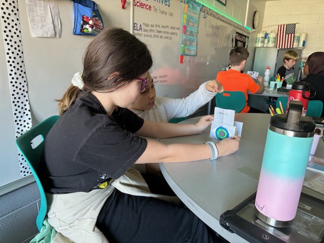 Our fourth grade students are exploring why the size of the pupil adjusts in the dark. They noticed how the picture gets sharper on the index cards as the pupil gets smaller. This explains why nocturnal animals can see in the dark. #KirbyONE40 #McAuliffeProud