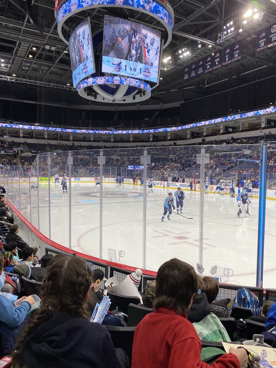 pe_RETSD's tweet photo. Prince Edward students enjoying an ⁦@ManitobaMoose⁩ daytime game.  First hockey game for some of our newcomer Ukrainian students as well!  What a great idea!!  ⁦@RETSDschools⁩  #gomoosego https://t.co/w6rKRFzmBX