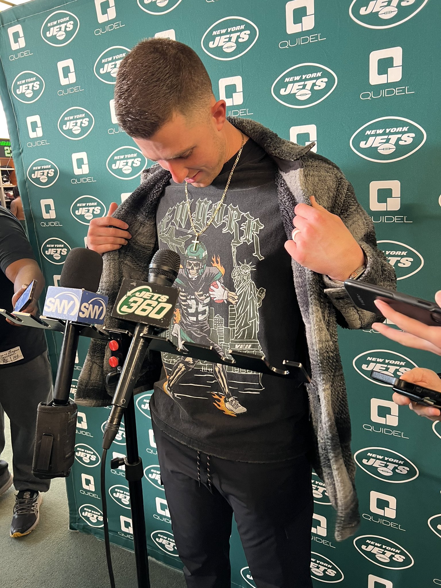 Connor Hughes on X: '#Jets QB Mike White meeting media … in a Ty Johnson t- shirt. Can see why guys love this dude 