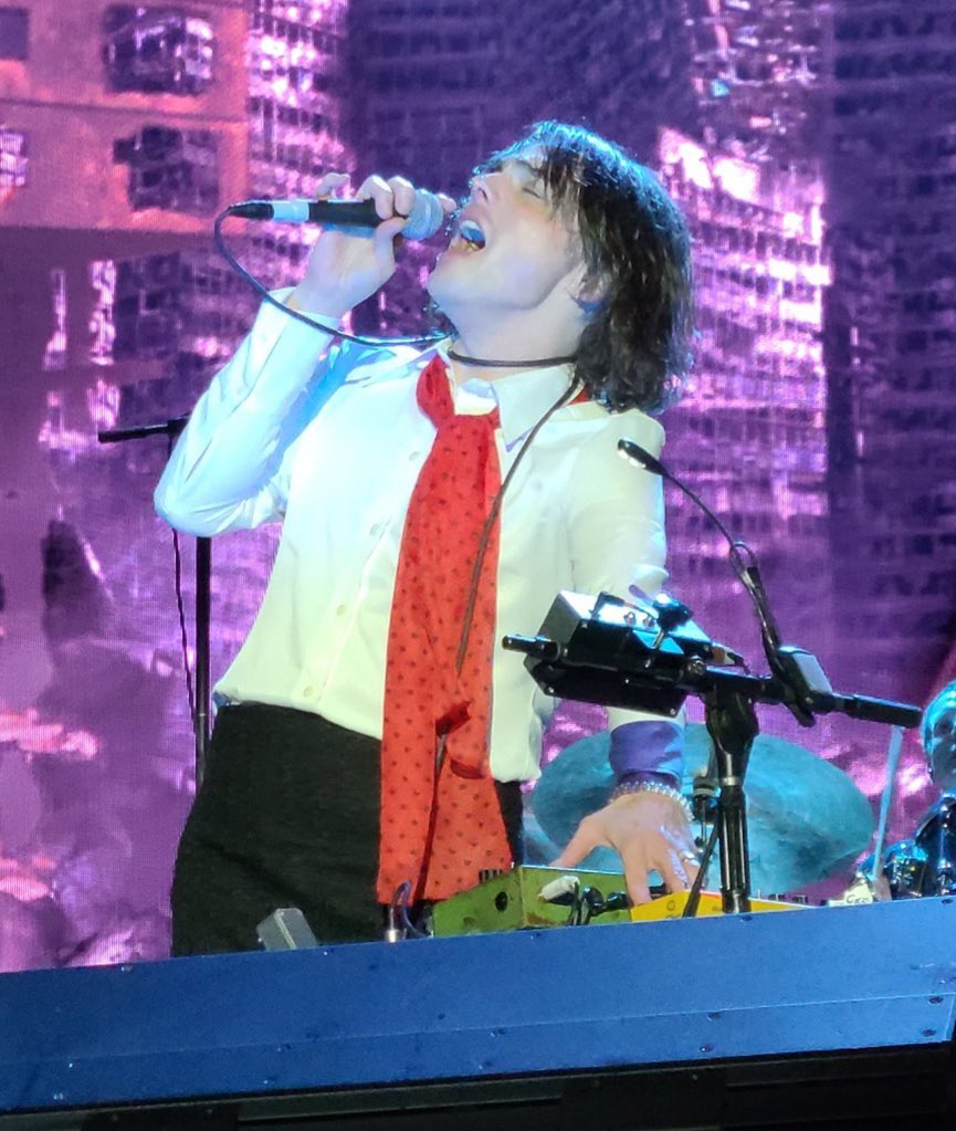 sometimes i remember the majority of the population are unaware that gerard way was on stage in a skirt with a mic chord around his neck and suddenly i feel so privileged to be an mcr stan